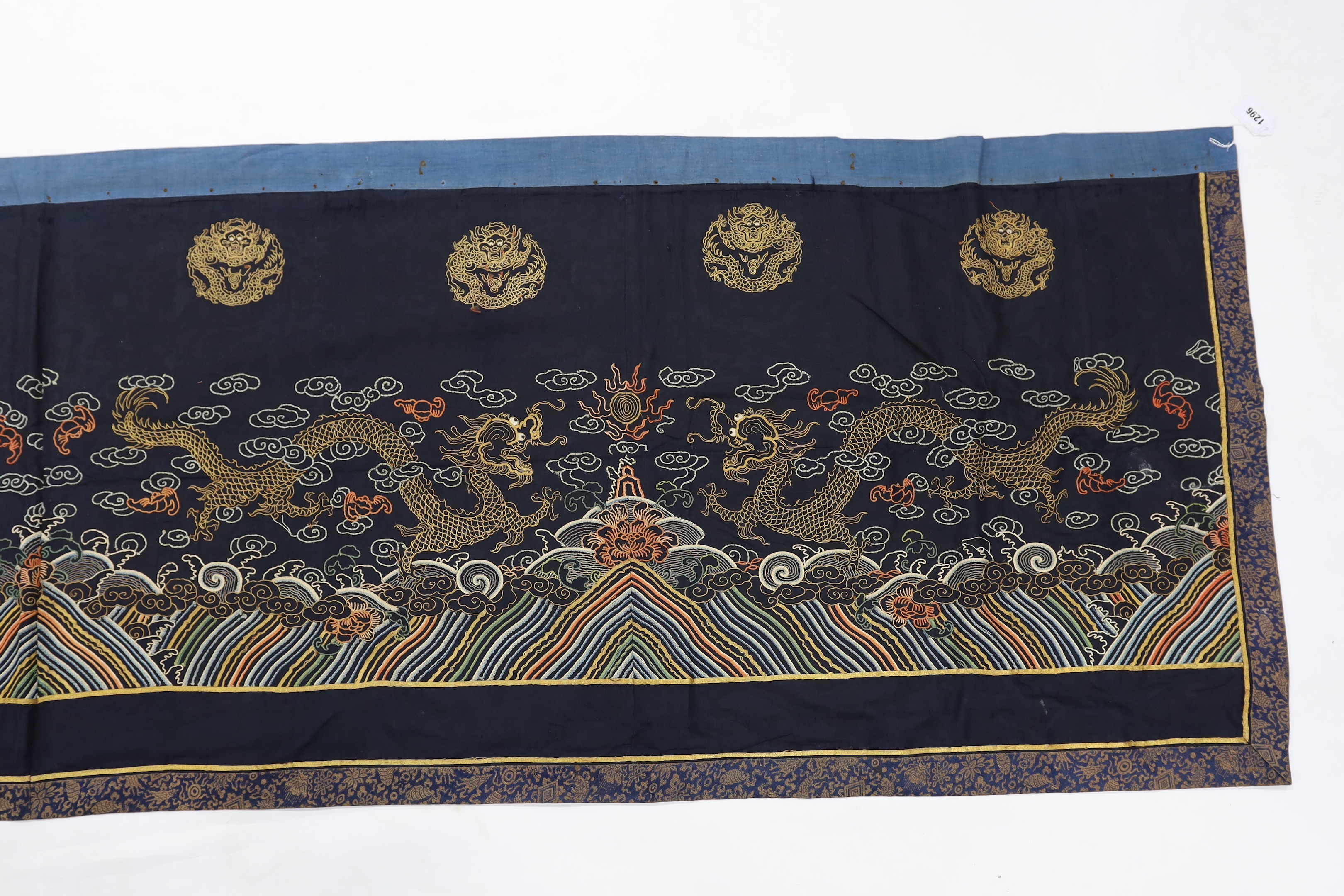 A Chinese long gauze gold dragon and multi-coloured embroidered altar cloth, with brocade borders, 290cm long x 78cm high
